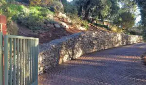 when does a slope need a retaining wall